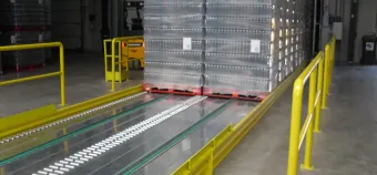 Roller and chain loading system for Slipchain pallets