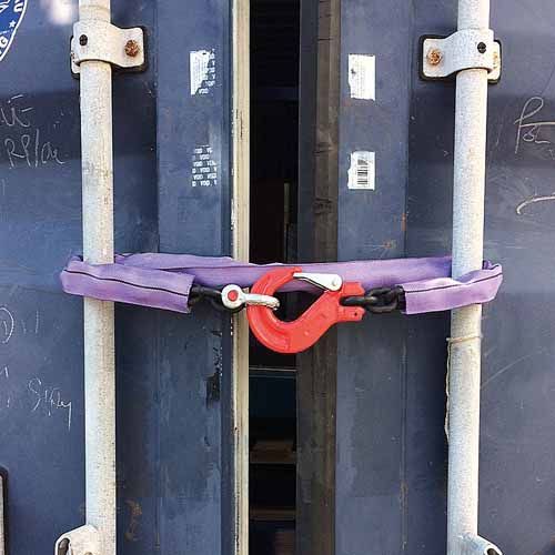 CONTAINER DOOR OPENING RESTRAINT SYSTEM